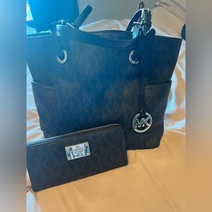 Black Michael Kors handbag and matching wallet